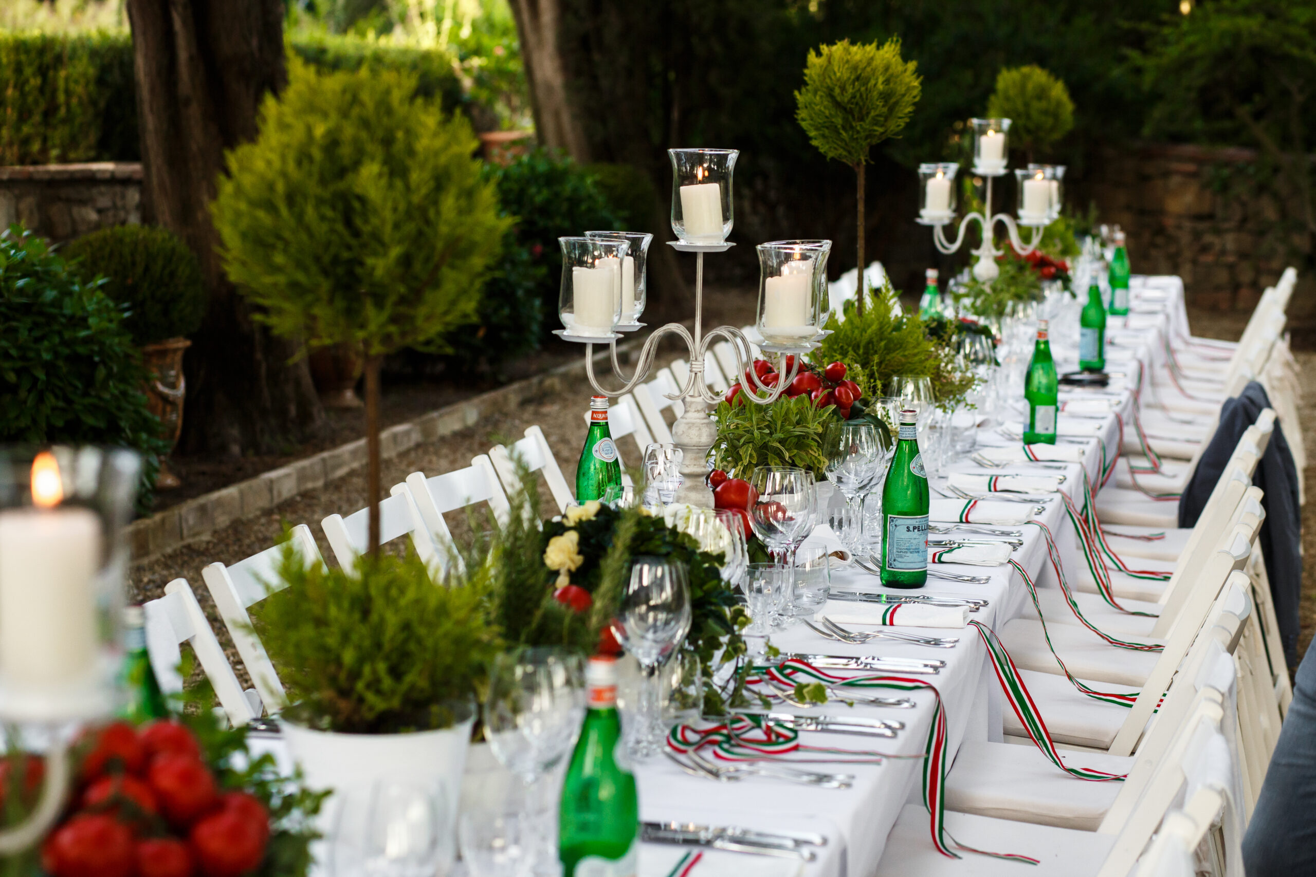 Festive dinner table decorated in white and green tones